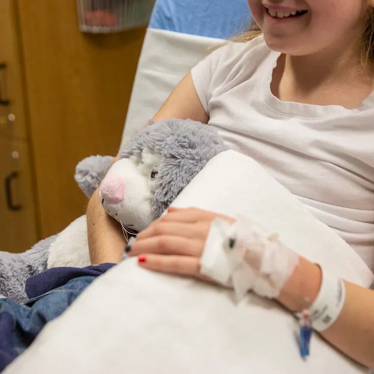 Keira McGrenehan, 10, sits with her stuffed animal after receiving her Remicade infusion for colitis at the Center for GI Motility of Children's Hospital of Philadelphia on Wednesday, Dec. 12, 2018.