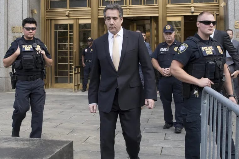 Michael Cohen leaves federal court, Tuesday, Aug. 21, 2018, in New York.