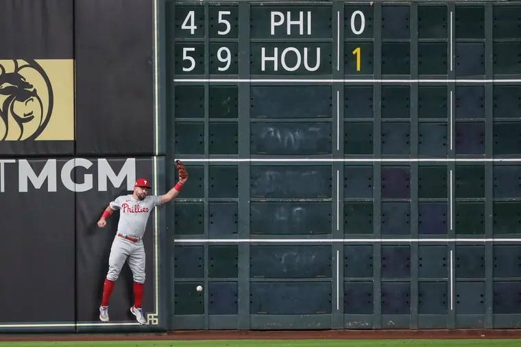 Philadelphia Phillies left fielder Kyle Schwarber fails to make a catch allowing the Astros to score in the first inning of baseball's World Series Game 2 against the Houston Astros at Minute Maid Park i Houston on Saturday.