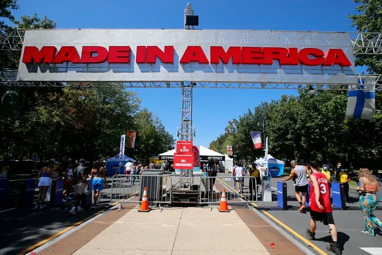 Music fans enter the Made In America music festival at the Philadelphia Museum of Art along the Benjamin Franklin Parkway on Sept. 4, 2021.