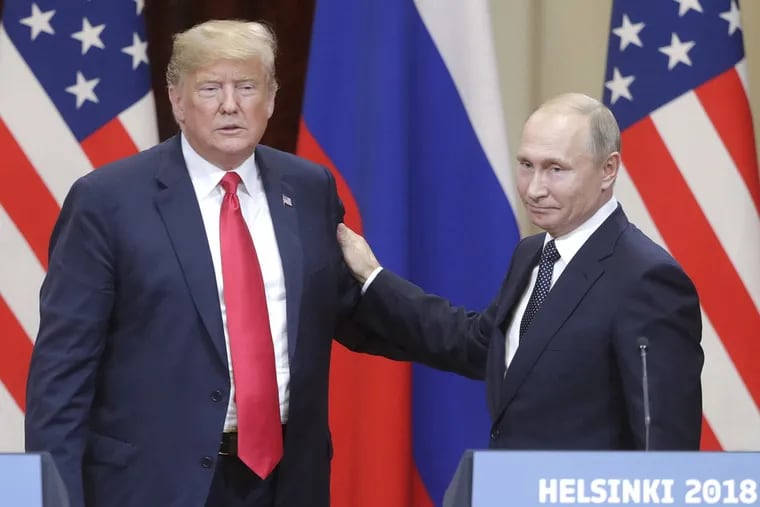 President Donald Trump and Russia's President Vladimir Putin give a joint news conference following their meeting at the Presidential Palace in Helsinki, Finland, on July 16, 2018.