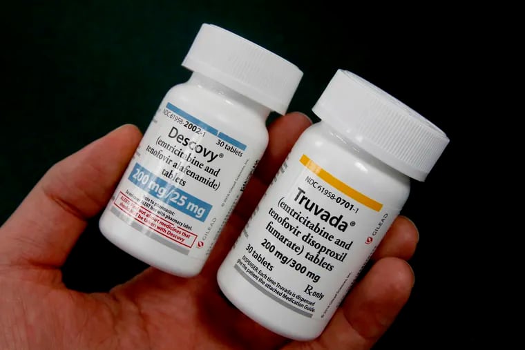 Pharmacist Clint Hopkins displays the HIV prevention drugs Descovy, left and Truvada, right, at Pucci's Pharmacy in Sacramento, Calif., Monday, Oct. 7, 2019. Gov. Gavin Newsom signed a bill, SB159, by state Sen. Scott Wiener, D-San Francisco, Monday, authorizing pharmacists to sell the HIV preventative medications, to patients without a physician's prescription. (AP Photo/Rich Pedroncelli)
