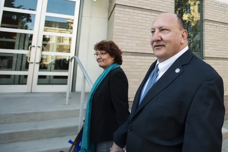 Former Allentown Mayor Ed Pawlowski walks with his wife, Lisa Pawlowski, toward the federal courthouse building to be sentenced on charges that he traded city contracts for campaign cash in downtown Allentown, Pa., on Tuesday, Oct. 23, 2018. Ed Pawlowski was convicted in March.