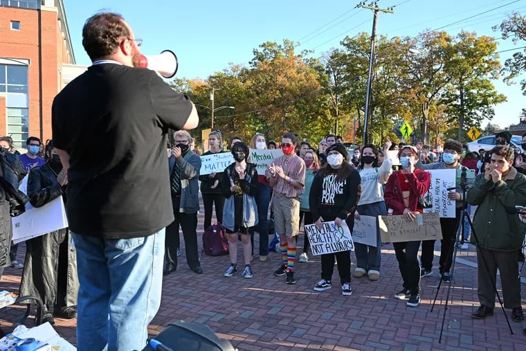 During a rally Monday at Rowan University, music major Ryan Clare recites students’ demands for better mental health services on campus in the wake of the recent death of a student.