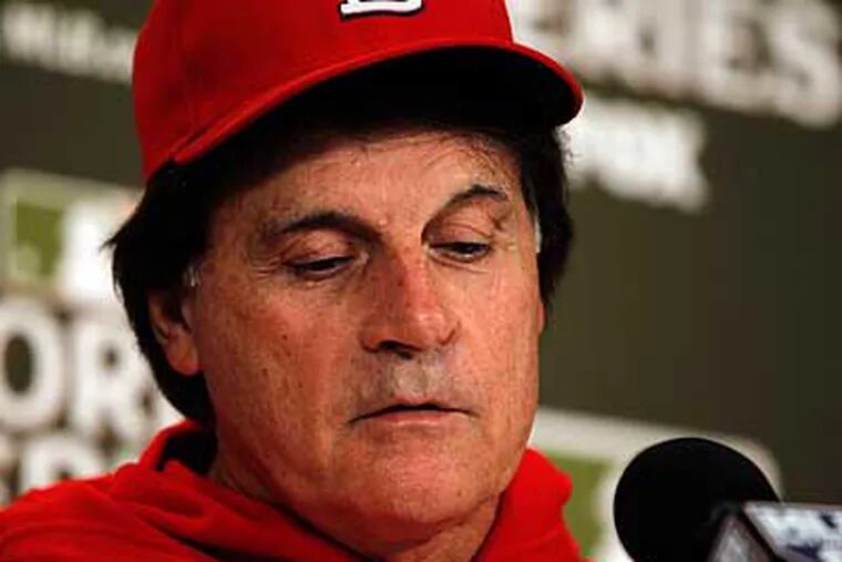 Cardinals manager Tony La Russa blamed his bullpen usage in Game 5 on a communication error. (Jeff Roberson/AP)