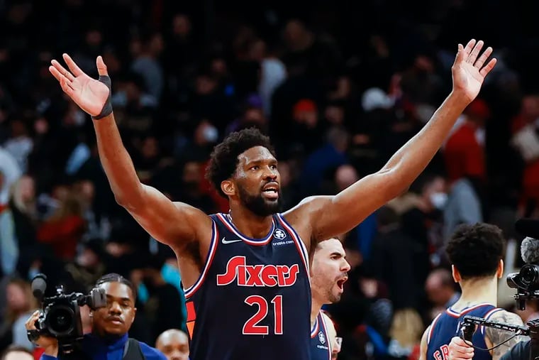 Joel Embiid celebrates his the game-winning three-pointer in overtime on Wednesday.