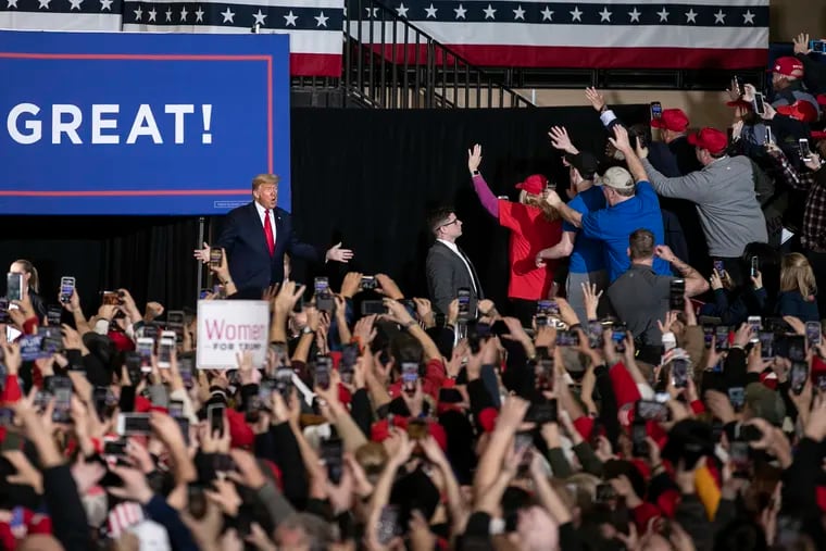 President Donald Trump enters a Keep America Great campaign rally in Wildwood, NJ on Tuesday, Jan. 28, 2020. Rep. Jeff Van Drew (R-NJ) joined him at the rally.