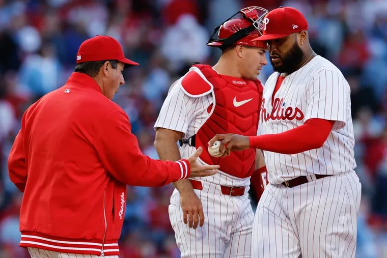 Phillies manager Rob Thomson pulls reliever Jose Alvarado from the game in the eighth inning. He faced seven batters and retired only two.