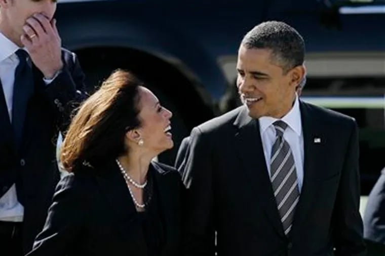 FILE -- in this Feb. 16, 2012 file photo President Barack Obama walks with California Attorney General Kamala Harris after arriving at San Francisco International Airport in San Francisco. Obama praised Harris for more than her smarts and toughness at a Democratic Party event Thursday, April 4, 2013. The president also commended Harris for being "the best-looking attorney general" during a Democratic fundraising lunch in the Silicon Valley. (AP Photo / Eric Risberg, File)