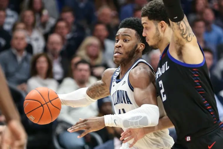 Villanova's Saddiq Bey attempts to drive to the basket while DePaul's Jaylen Butz defends during the second half of Tuesday night's overtime win for the Wildcats.