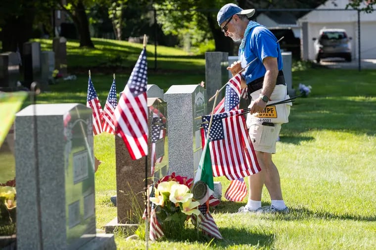 Ken Rucci, Sr.,70, of Westbrook Park, started in 2004 placing flags on the grave of his father, Paul Rucci, a World War II veteran., and a few other relatives.  It helped him deal with the loss of his father who had passed away in the fall of 2003.  He now places approximately 500 flags on the graves of veterans at Saints Peter  and Paul Cemetery in Springfield, Delaware County.  He is shown on May 24, 2024, the first day of a two day process