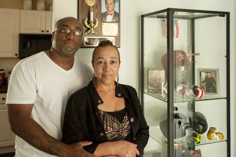 Carla Reyes-Miller and Kevin Miller keep a case of memories from son Kevin, who was slain at age 19 in June 2011.