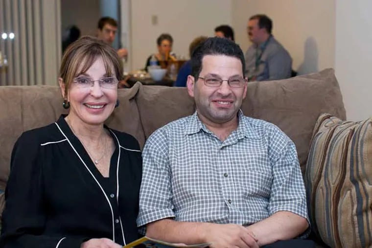 Jonah Selber - with his mother, Judith Creed - works at Jefferson University Hospital and now has his own apartment. He recently got to donate $15,000 to charities.