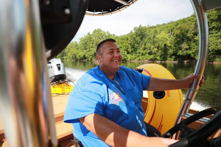 Greg Crance, the Famous River Hot Dog Man and owner of Delaware River Tubing, navigates the Delaware River as he checks on his operation.