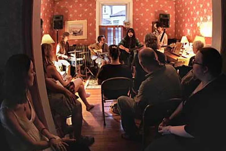 Samantha Crain and her band perform in the Bob Beach home in Lansdowne. Artists generally get 100 percent of the cover charge, and a thoroughly attentive audience, for such concerts. (DAVID M WARREN / Staff Photographer)