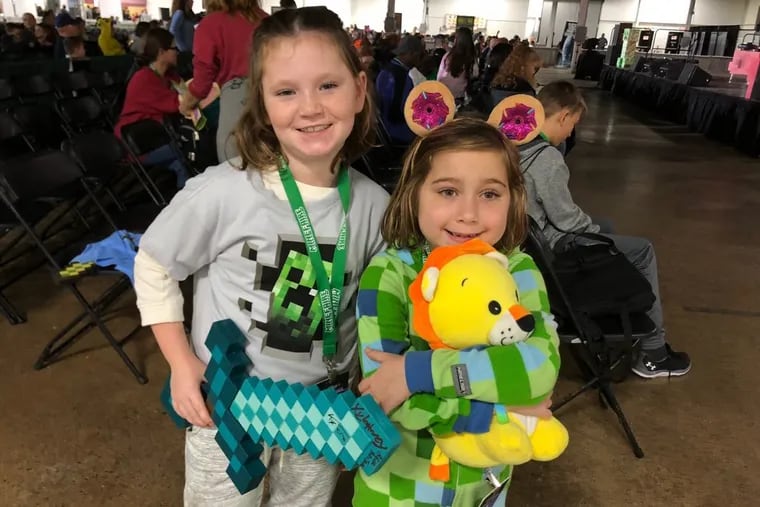 Bradin Roberts, 10, of Sea Isle City and cousin Abaigeal Wallace, 8, of Virginia Beach visited Minefaire in Oaks, Pa., on Saturday.