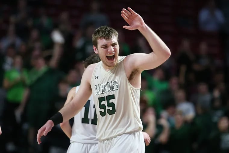 Jeff Woodward of Methacton celebrates after his dunk against Chester in the District 1, Class 6A semifinals at the Liacouras Center on Feb. 25.