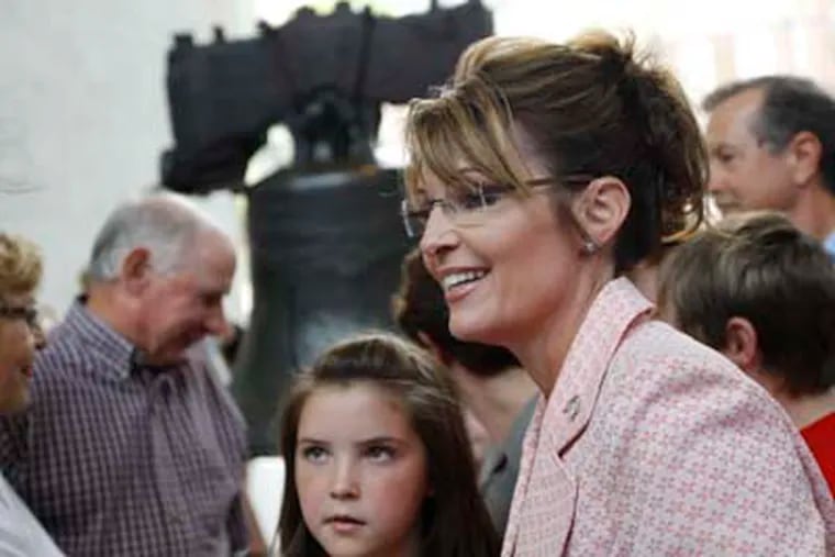 Sarah Palin, accompanied by daughter Piper Palin, meets with people at the Liberty Bell at Independence National Historical Park Tuesday afternoon. (AP Photo/Matt Rourke)