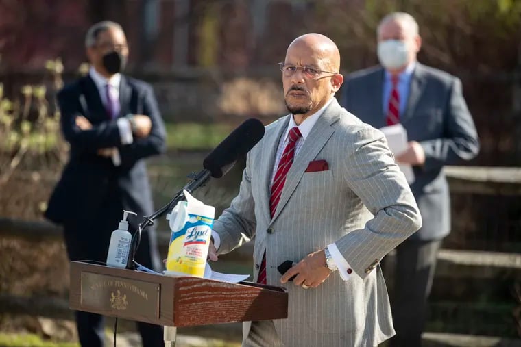 State Sen. Vincent Hughes and others gathered outside Martin Luther King High School in West Oak Lane on Monday to call for increased education funding.