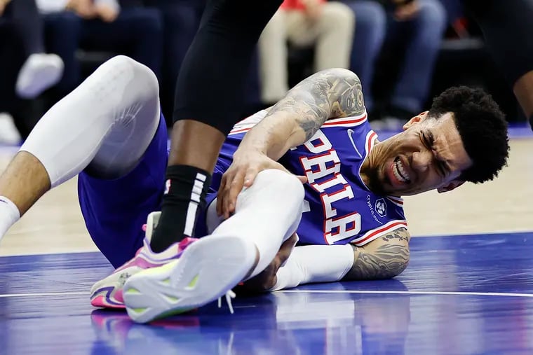 Sixers forward Danny Green holds his knee after getting injured against the Miami Heat in game six of the second-round Eastern Conference playoffs on Thursday, May 12, 2022 in Philadelphia.