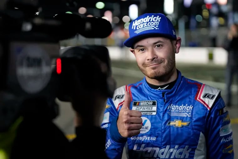 Kyle Larson gives a thumbs up after winning the pole position during qualifying for the NASCAR Daytona 500 auto race at Daytona International Speedway Wednesday in Daytona Beach, Fla.