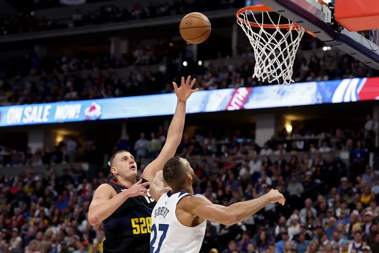 Nikola Jokic #15 of the Denver Nuggets drives to the basket against Rudy Gobert #27 of the Minnesota Timberwolves during the first quarter in Game Five of the Western Conference Second Round Playoffs at Ball Arena on May 14, 2024 in Denver, Colorado. (Photo by Matthew Stockman/Getty Images)
