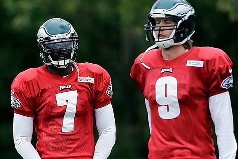 Philadelphia Eagles quarterback Michael Vick (left) and Nick Foles. (Matt Slocum/AP file photo)