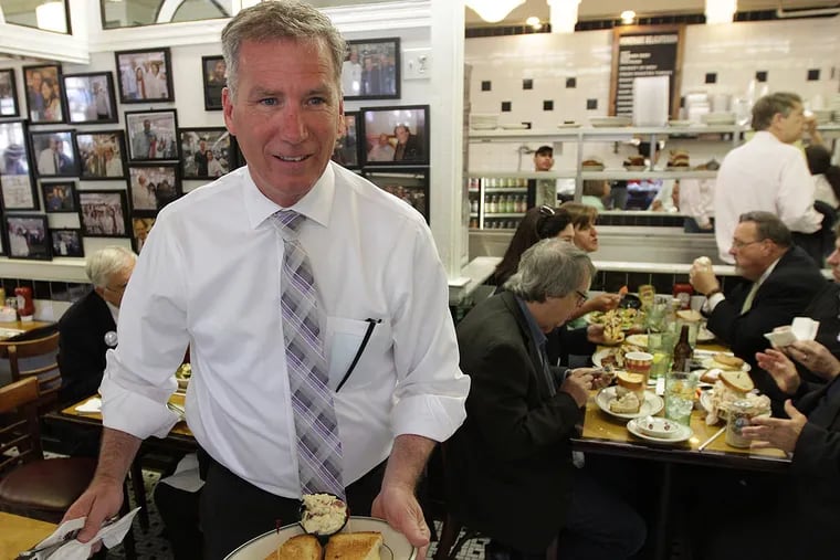Ed Neilson, who is vying for Bill Green's vacated seat on City Council, carries his lunch to a table at Famous 4th Street Deli on Election Day in Philadelphia on May 20, 2014. ( DAVID MAIALETTI / Staff Photographer )