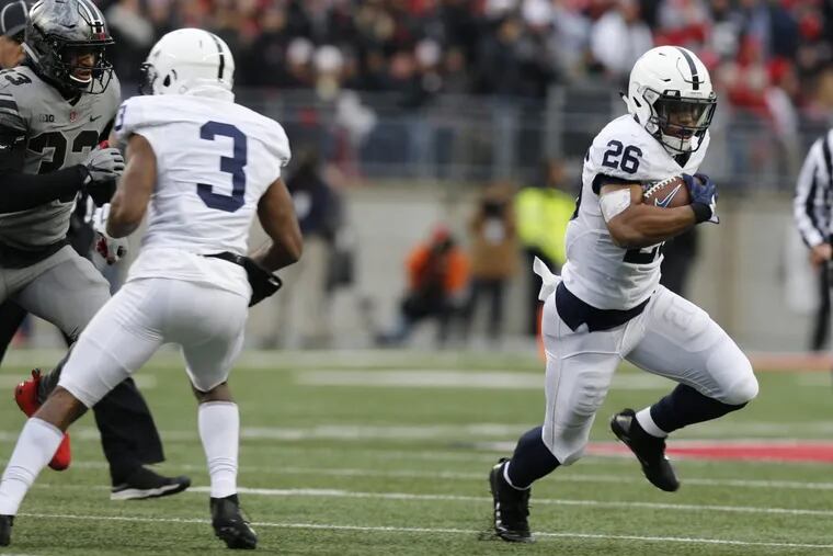 Penn State running back Saquon Barkley, right, cuts up field to score a touchdown against Ohio State.