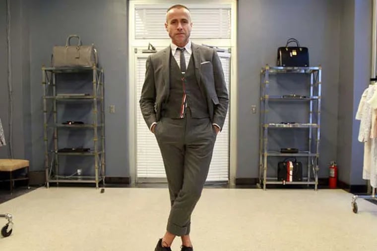 Lehigh Valley native Thom Browne, famous for making Michelle Obama's memorable inaugural coat, sports a suit of his own at his Tribeca shop February 18, 2013. ( DAVID SWANSON / Staff Photographer )