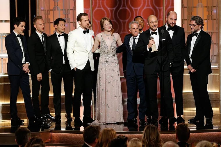 (From left to right) Jordan Horowitz, Fred Berger, Producers, "La La Land", accepting the award for Best Motion Picture - Musical or Comedy, at the 74th Annual Golden Globe Awards held at the Beverly Hilton Hotel on January 8, 2017.