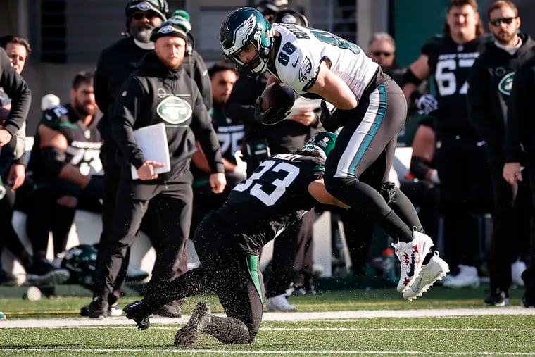 Philadelphia Eagles tight end Dallas Goedert (right) catches a pass in front of the Jets Elijah Riley (left) in the first quarter.