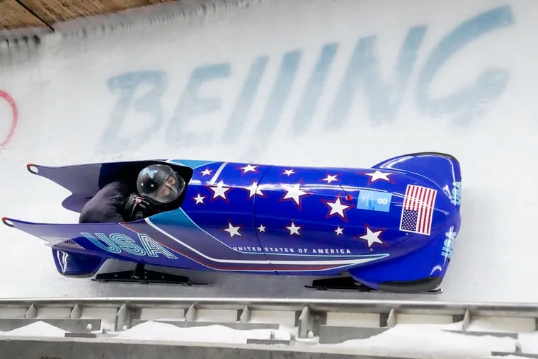 Elana Meyers Taylor and Sylvia Hoffman of the United States slide down the track during the second heat of the two-woman bobsled competition in Beijing.