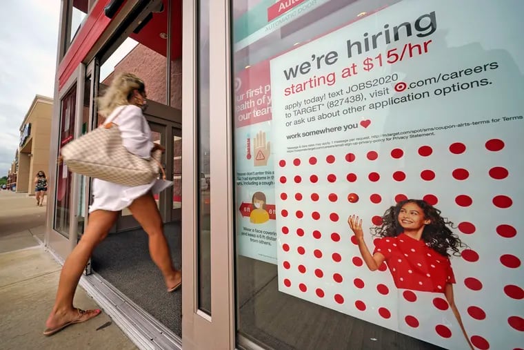 In this Sept. 2, 2020, file photo, a help wanted sign hangs on the door of a Target store in Uniontown, Pa.  (AP Photo/Gene J. Puskar, File)