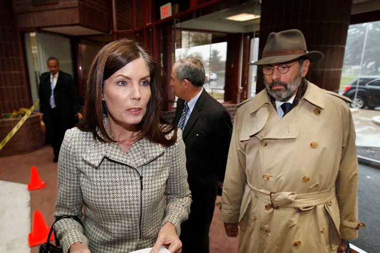 Pennsylvania Attorney General Kathleen Kane reads a statement to reporters upon her arrival in Norristown to testify before a grand jury. ( MICHAEL S. WIRTZ / Staff Photographer  )