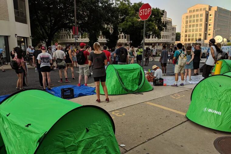 Protesters opposed to the immigration policies of the Trump Administration pitched tents outside the Philadelphia office of ICE on Monday.