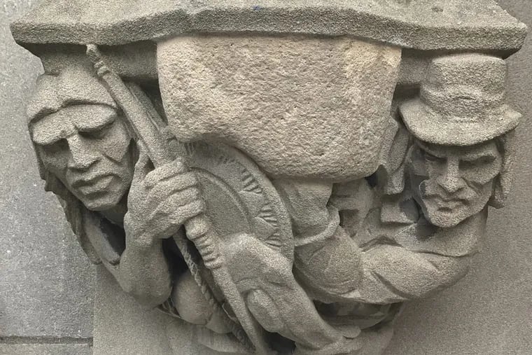 A 1929 doorway carving on Yale’s campus depicts a Puritan settler with a musket pointing at a Native American. The musket — but not the Indian’s bow — has been covered with a stone. The university has said it will remove the stone.