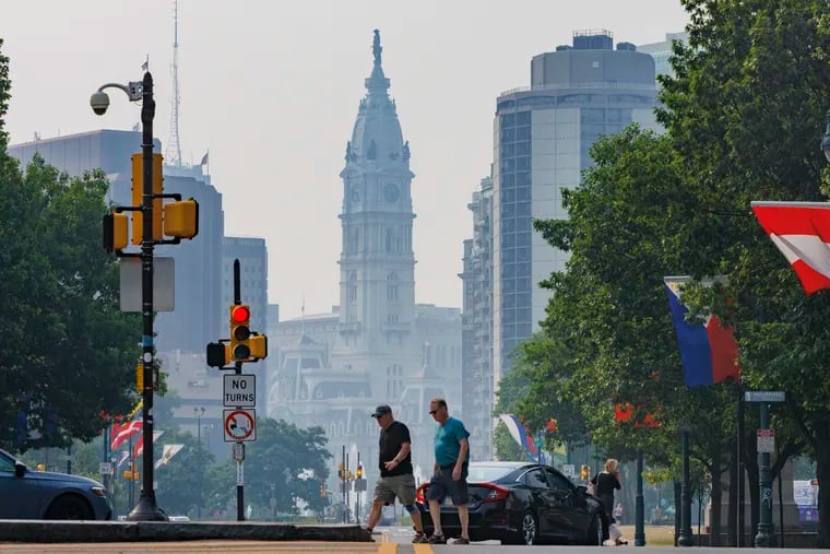 Philadelphia City Hall, as seen from the Parkway, is covered in a haze because of Canadian wildfire smoke Wednesday.
