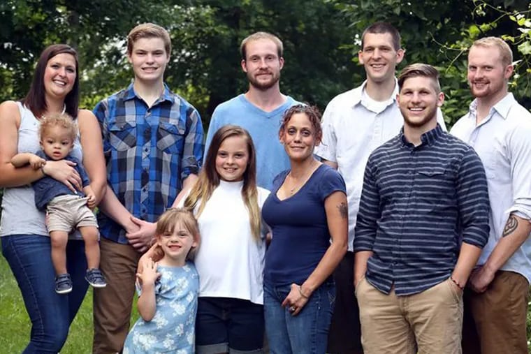 The Guntz children, back row, left to right: Jessica holding Austin, Zachary, Philip, Ben, Logan.<br/>
Front row, left to right: Alexandra; Alyssa; Erika; Christopher.