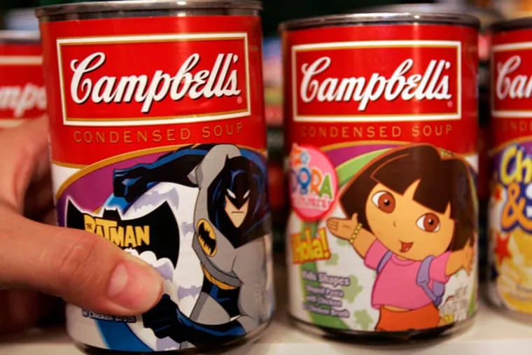 Kim Chou pulls out a can of Campbell's soup from her pantry at her home in San Jose, Calif., in this May 20, 2007 file photo. (AP Photo/Paul Sakuma, file)