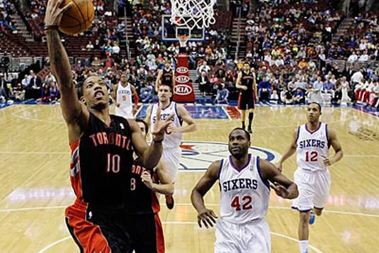 Raptors guard DeMar DeRozan goes up for a layup against the Sixers in the first half on Wednesday. (Alex Brandon/AP)