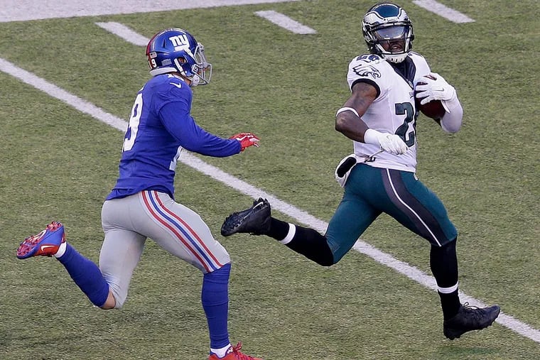 Philadelphia Eagles strong safety Walter Thurmond (26) looks back at
New York Giants wide receiver Myles White (19) as he runs for a touchdown after intercepting a pass during the third quarter of an NFL
football game, Sunday, Jan. 3, 2016, in East Rutherford, N.J.