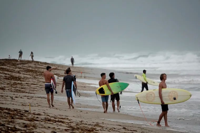 Surfers in Delray Beach. The South Florida seaside town has become the setting for a curious subplot surrounding National Realty Investment Advisors, a big developer in Philadelphia that's being investigated by the FBI and securities regulators.