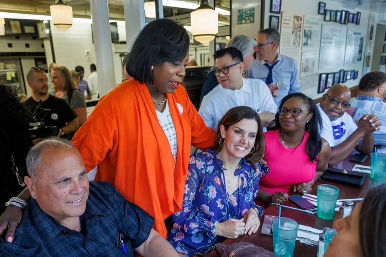 Cherelle Parker, second from left, greets City Controller Christy Brady, center, and others at the traditional election day lunch at the Famous 4th Street Deli. Parker checked into the Hospital of the University of Pennsylvania hours later with severe tooth pain.