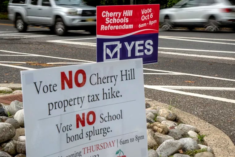 Lawn signs on both sides were out in Cherry Hill on Wednesday, the day before a special election where voters approved a $363 million bond referendum for improvements at the public school district's 19 buildings.