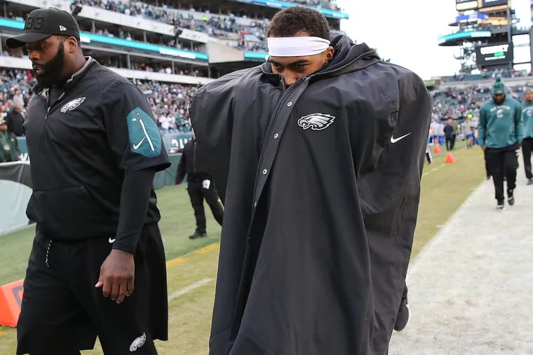 Eagles wide receiver DeSean Jackson, right, and offensive tackle Jason Peters, left, walk off the field after the win.