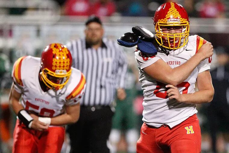 Haverford's Denis Spaventa (right) celebrates after tackling Ridley quarterback Cade Stratton.