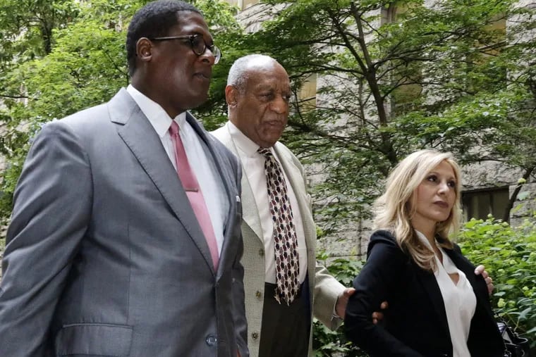 Bill Cosby, center, arrives May 23 with one of his attorneys Angela Agrusa, right, for the second day of jury selection in his sexual assault case at the Allegheny County Courthouse.