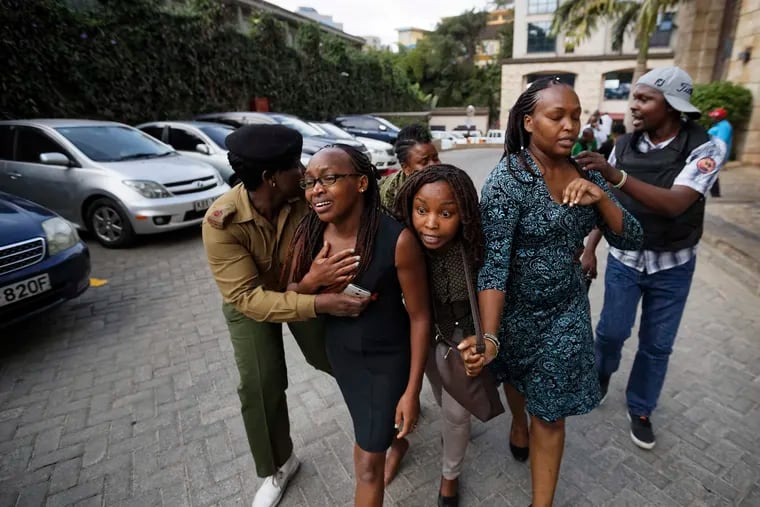 Civilians flee the scene at a hotel complex in Nairobi, Kenya, on Tuesday, Jan. 15, 2019.