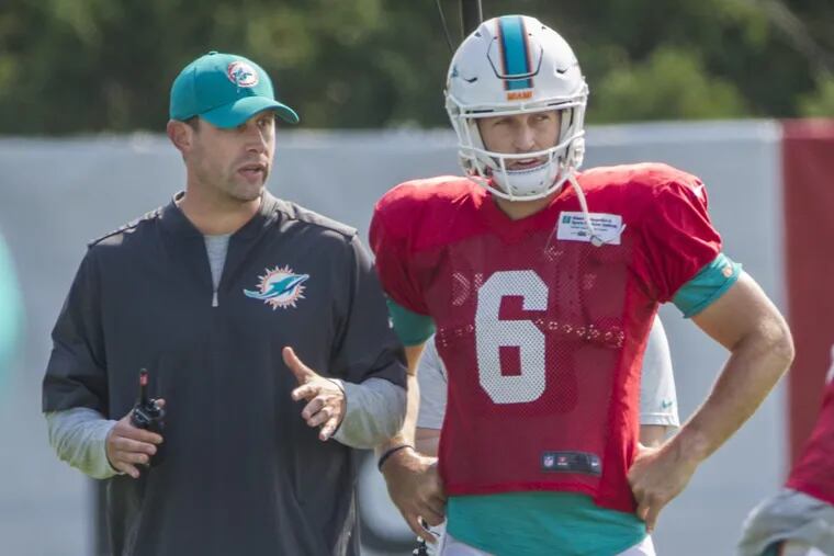 Dolphins head coach Adam Gase, left, talks things over with quarterback Jay Cutler, #6, right, during an offensive drill prior to the combined practice with the Philadelphia Ealges on Monday August 21, 2017. Philadelphia Eagles and the Miami Dolphins hold a combined practice on Monday.